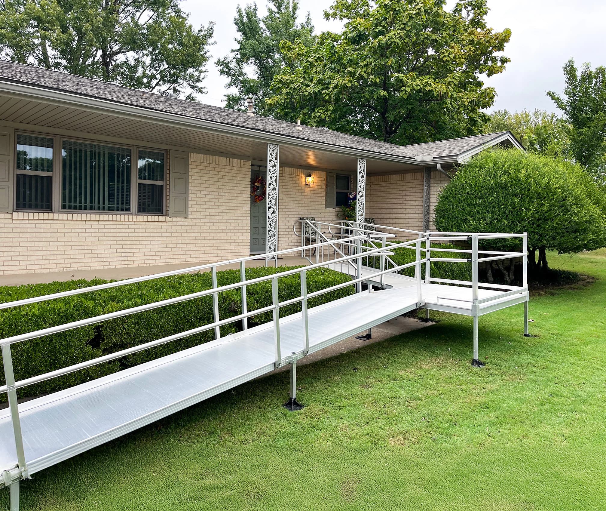 A wheelchair ramp installed on the exterior of a home.